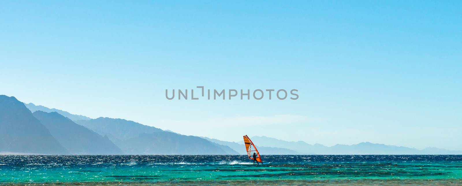 surfer rides in the Red Sea in Egypt
