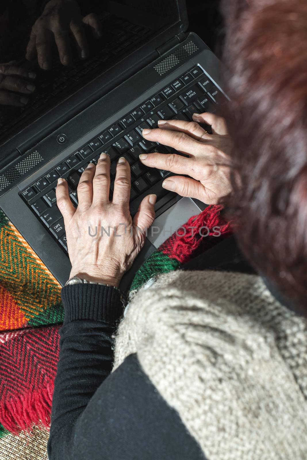 Old women using laptop by deyan_georgiev