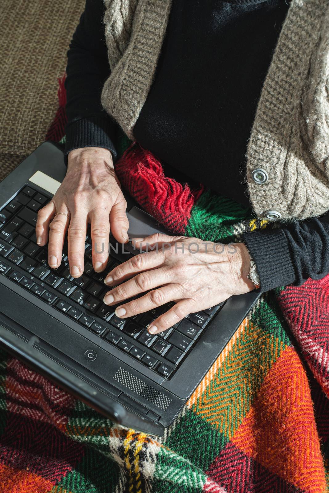 Old women using laptop by deyan_georgiev