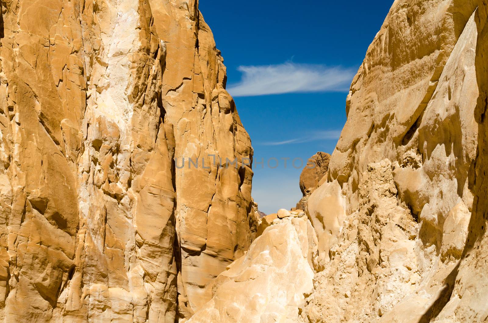 high rocky mountains against the blue sky and white clouds in the desert in Egypt Dahab South Sinai