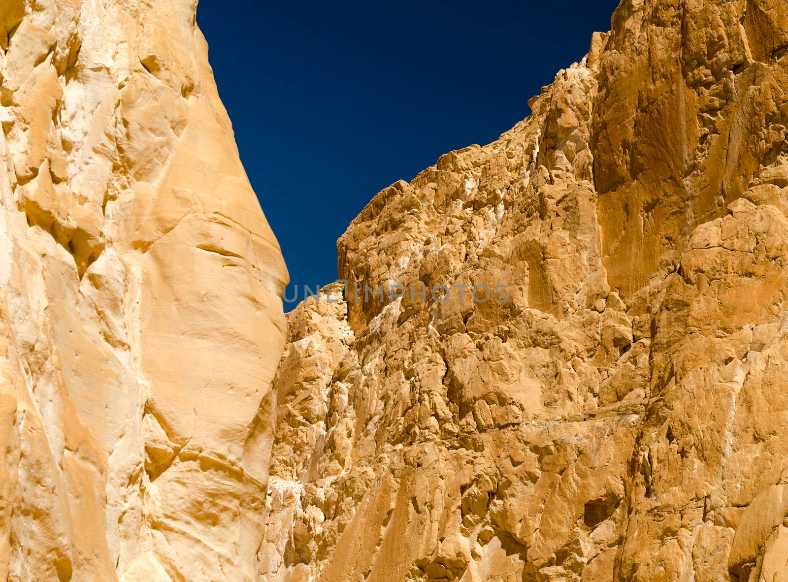 high rocky mountains against the blue sky in the desert in Egypt Dahab South Sinai
