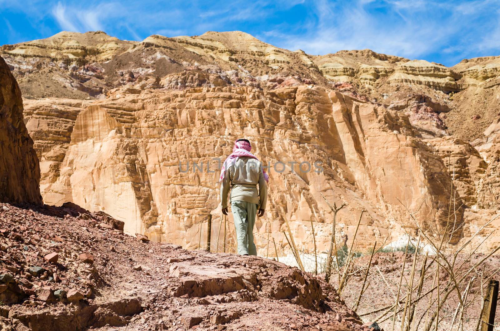 Bedouin climbs a mountain in Egypt Dahab