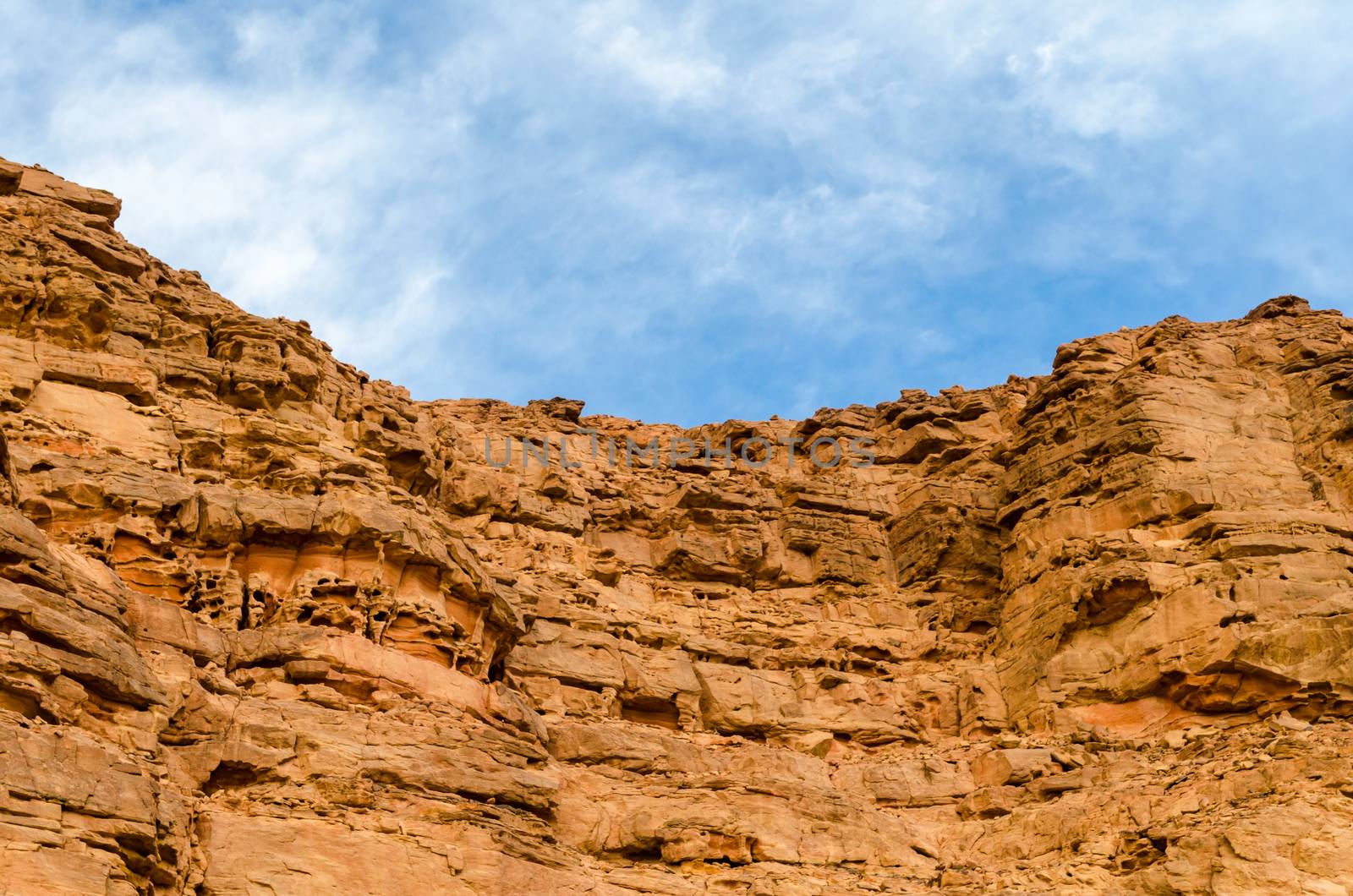 high mountains against the blue sky and white clouds