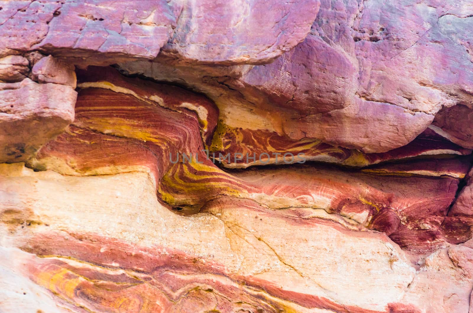 texture of orange stone rock in a colored canyon closeup