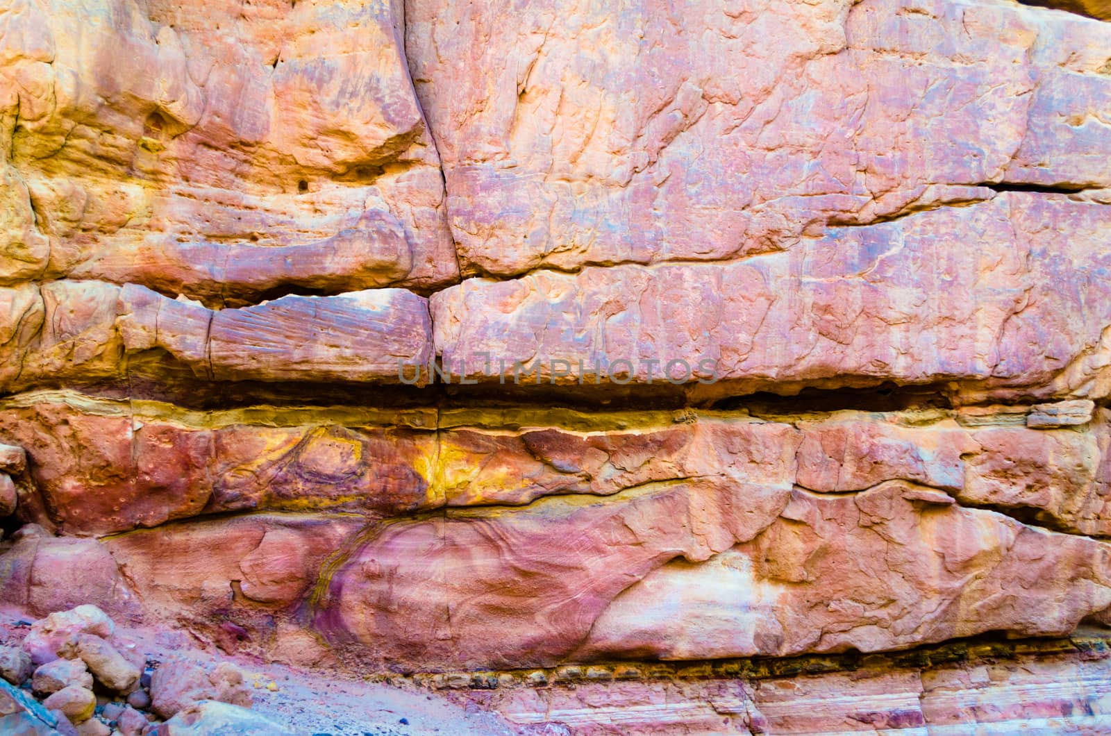 texture of orange stone rock in a colored canyon closeup