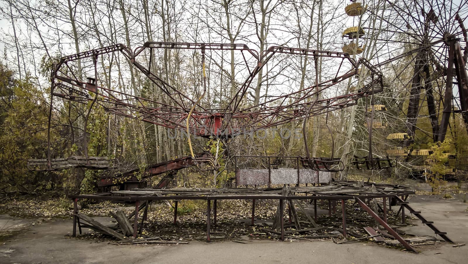 ruins of the carousel in an abandoned amusement park in Chernobyl