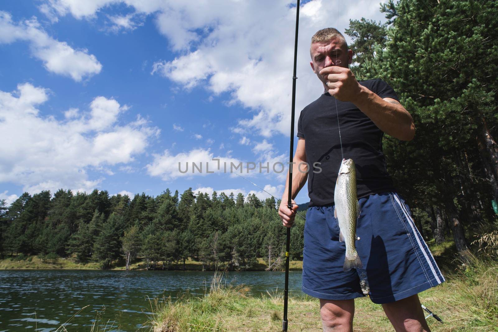 Fisherman caught a fish by deyan_georgiev