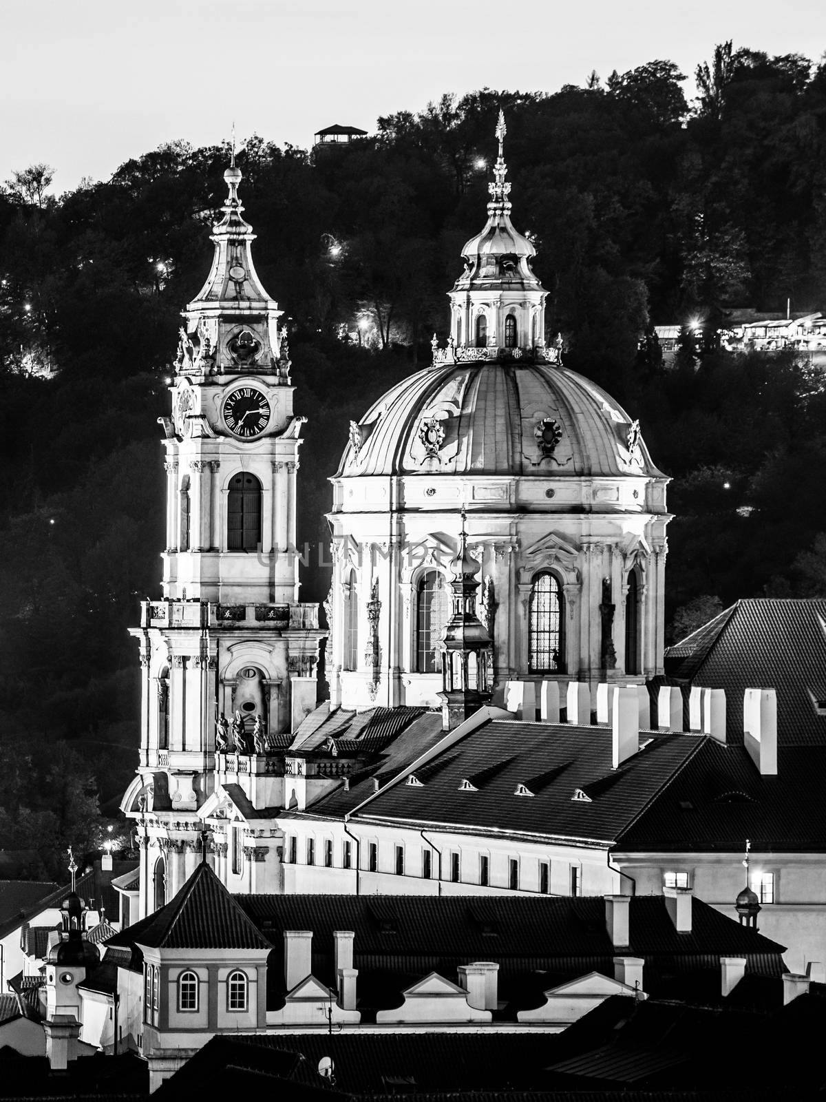 St Nicholas Church in Mala Strana, Lesser Town district, in the evening, Prague, Czech Republic. Black and white image.