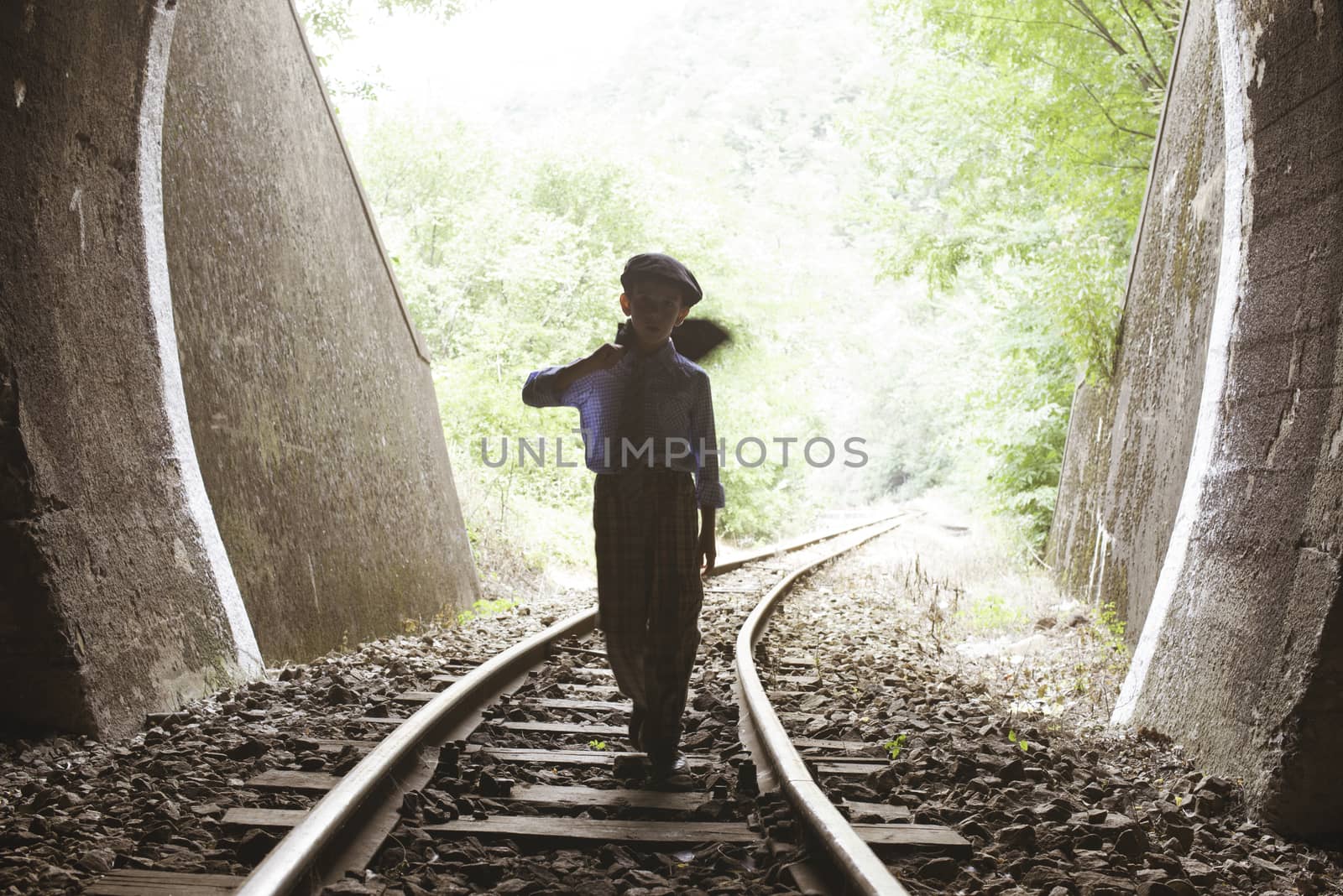Child walking on railway road by deyan_georgiev