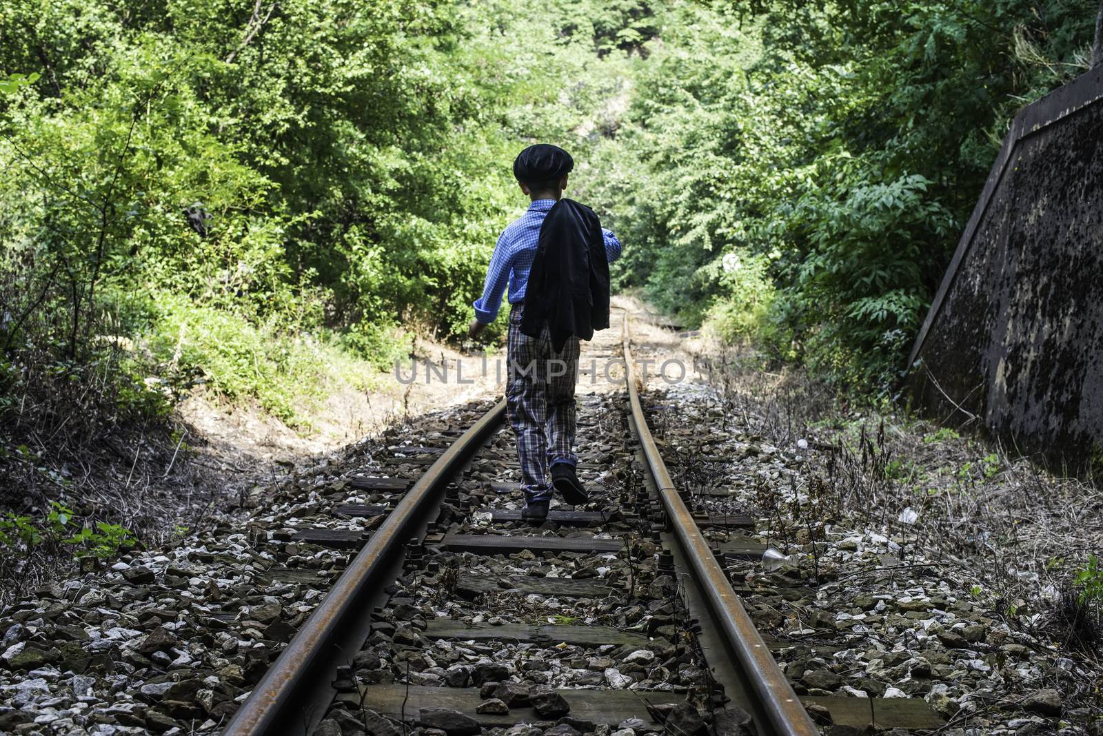 Child walking on railway by deyan_georgiev