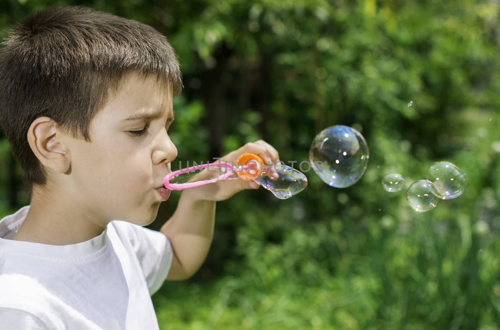 Child makes bubbles by deyan_georgiev