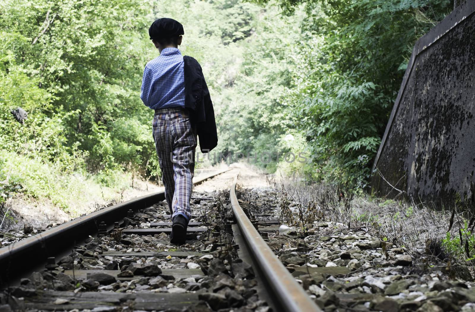 Child walking on railway by deyan_georgiev