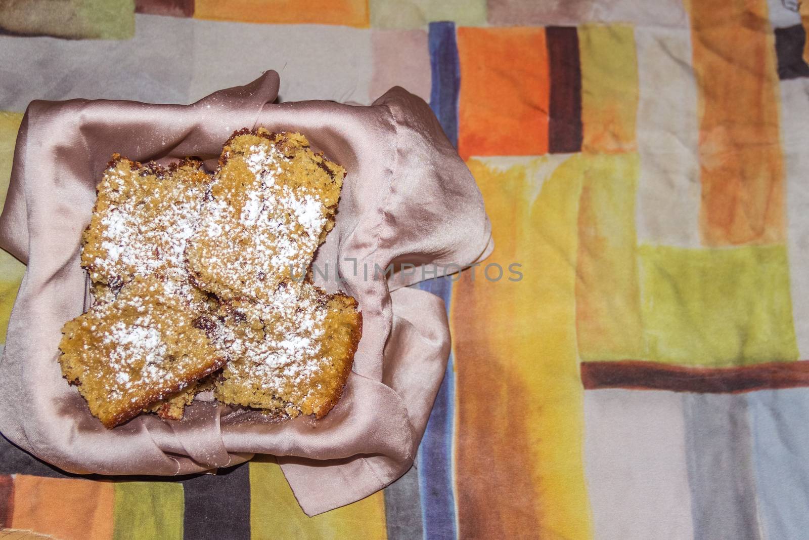 Homemade oatmeal and walnut cookies in cloth basket by leo_de_la_garza