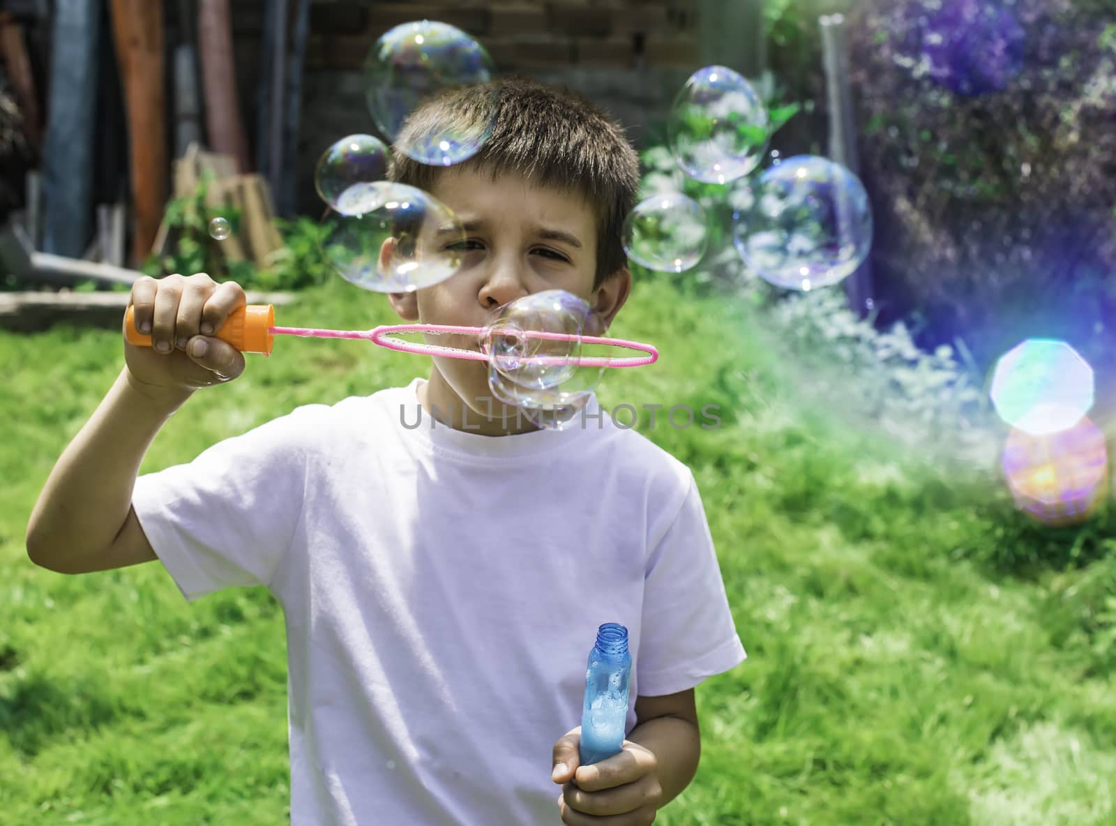 Child makes bubbles by deyan_georgiev