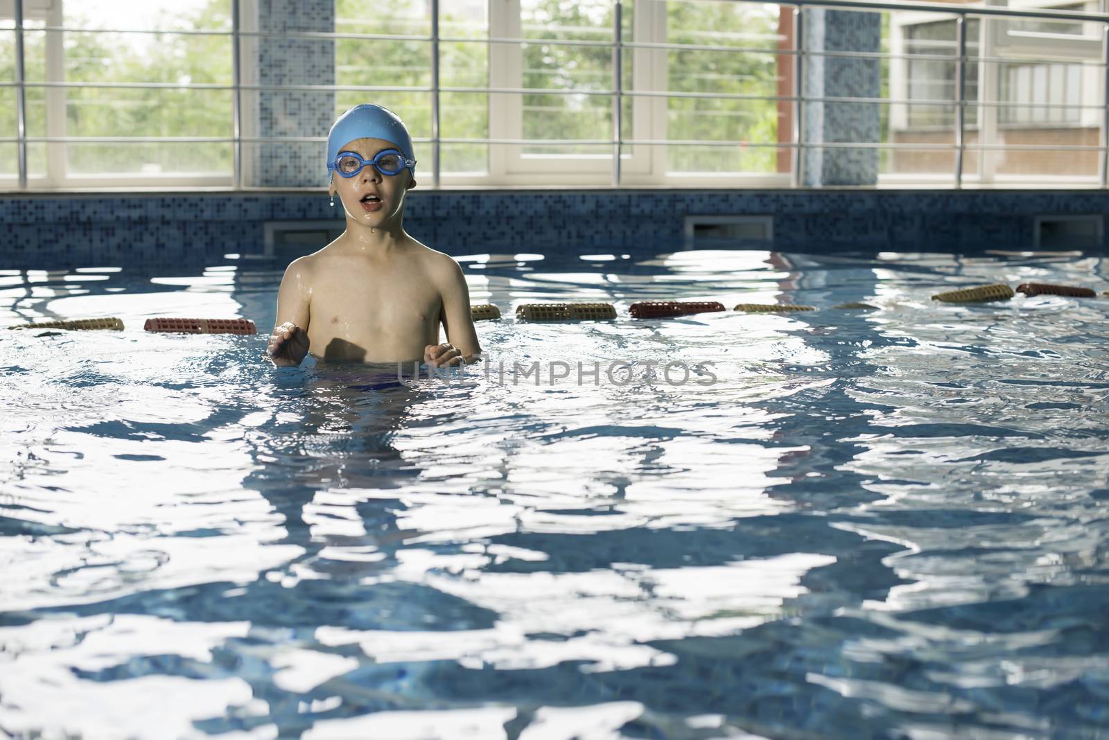 Child in swimming pool by deyan_georgiev