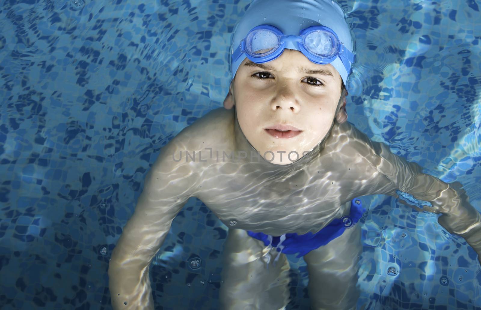 Child in swimming pool by deyan_georgiev
