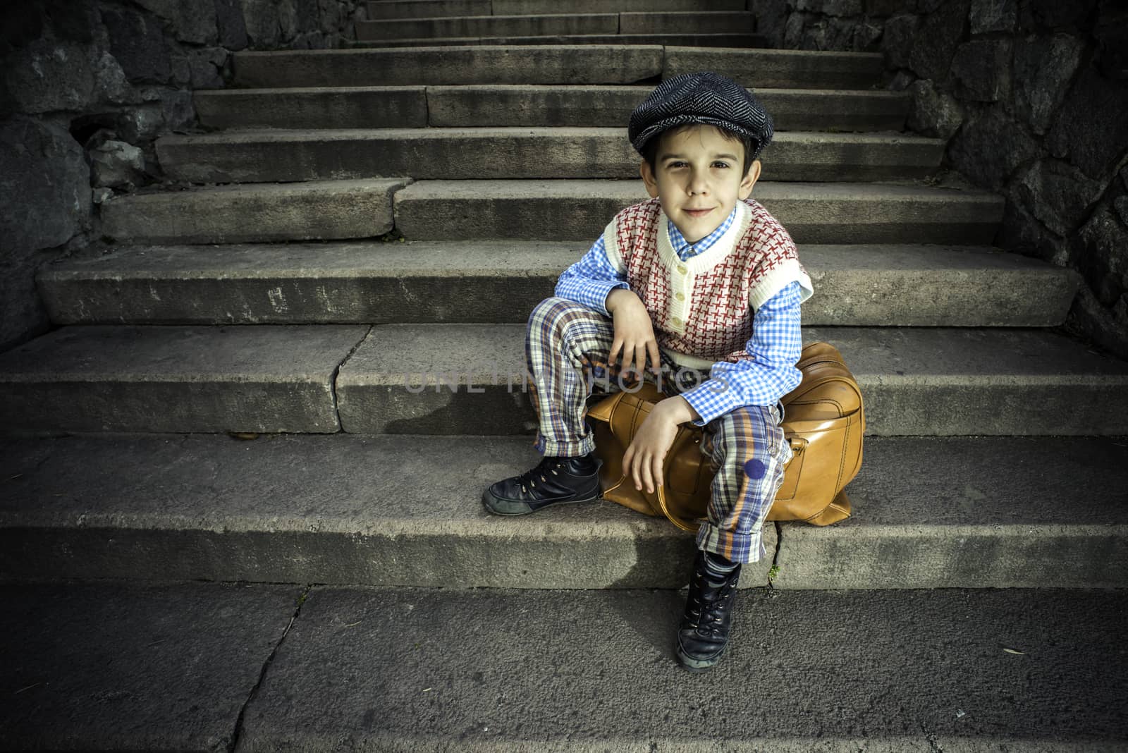 Exterior stairs and child with vintage bag. Vintage clothes style