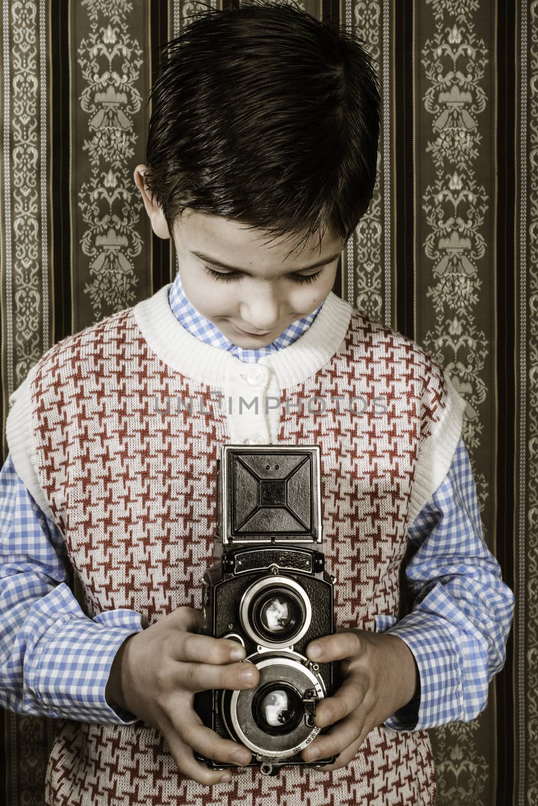 Boy with vintage camera. Vintage clothes