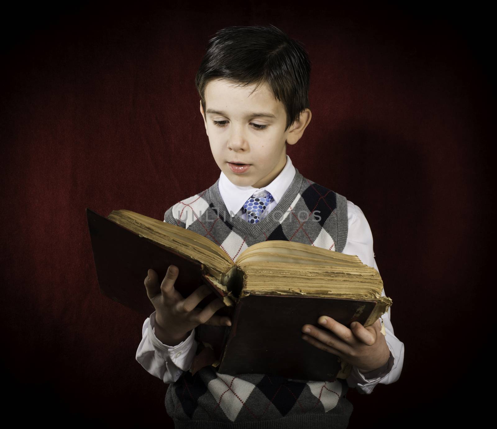 Child with red vintage book. Vintage clothes