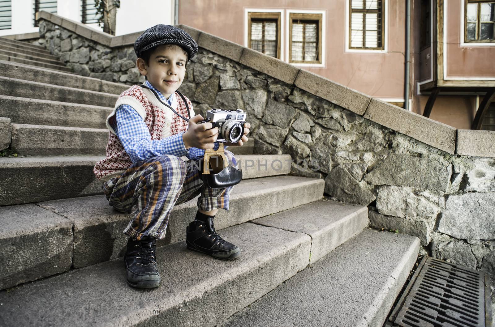 Child with vintage camera by deyan_georgiev
