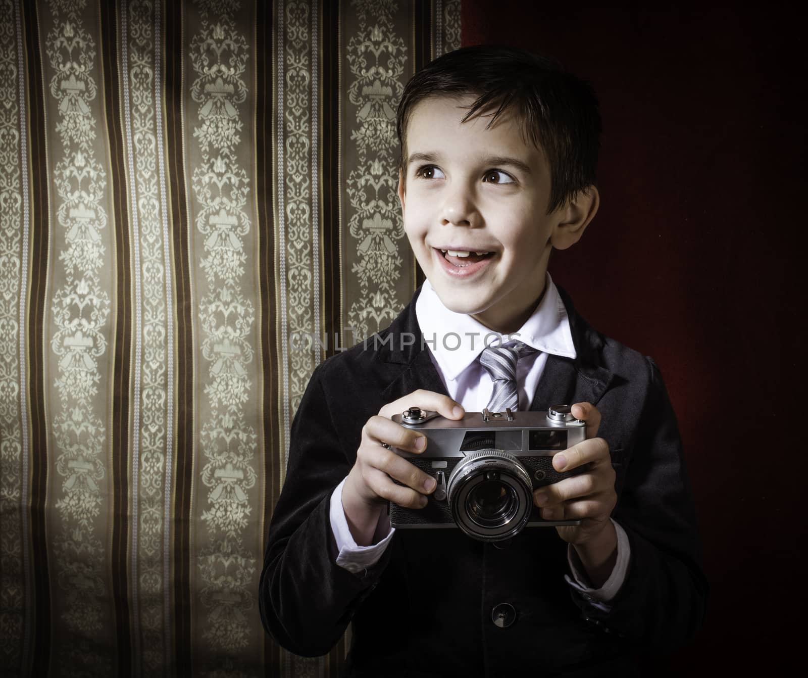 Child taking pictures with vintage camera by deyan_georgiev