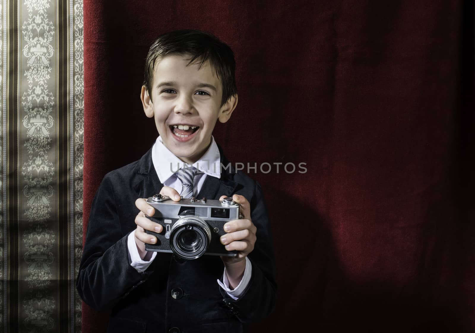 Child taking pictures with vintage camera by deyan_georgiev
