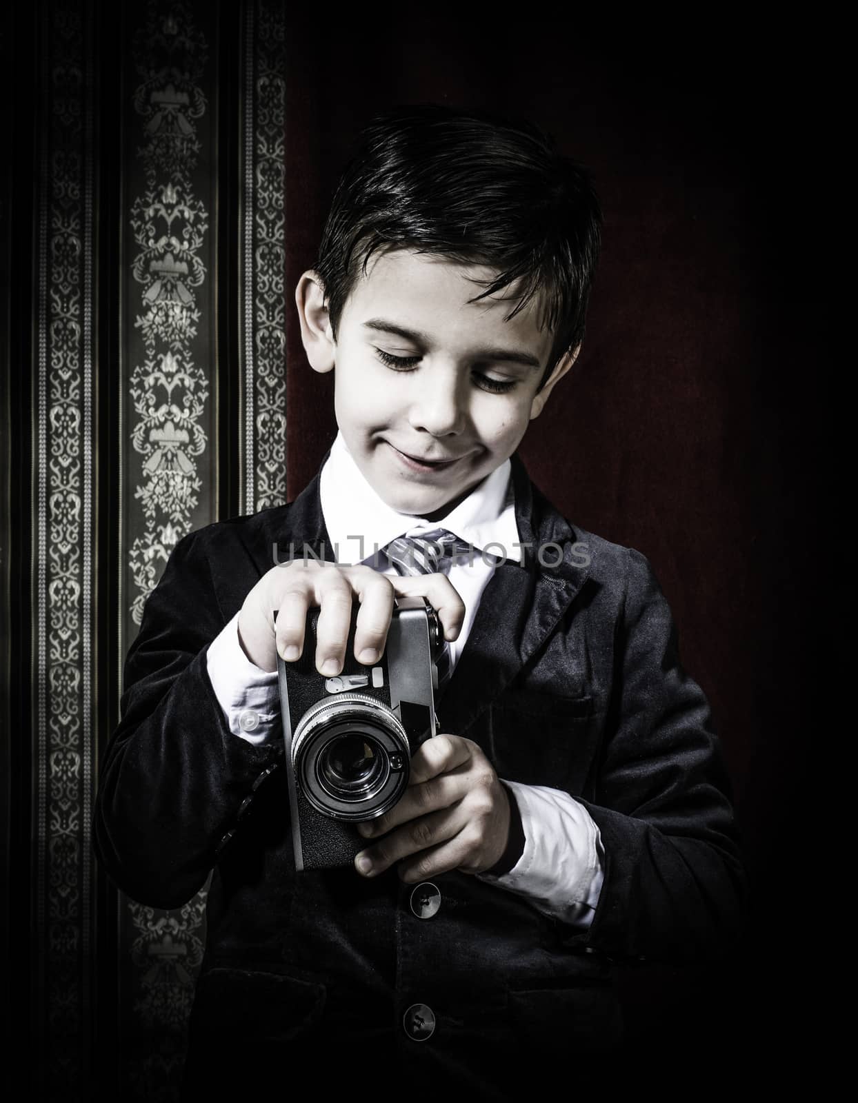 Child taking pictures with vintage camera by deyan_georgiev
