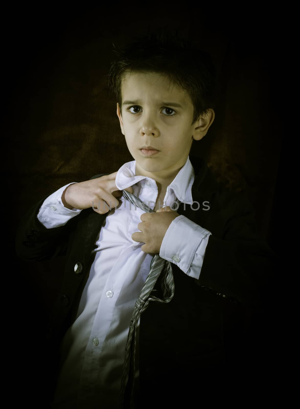 Boy in vintage black suit and tie