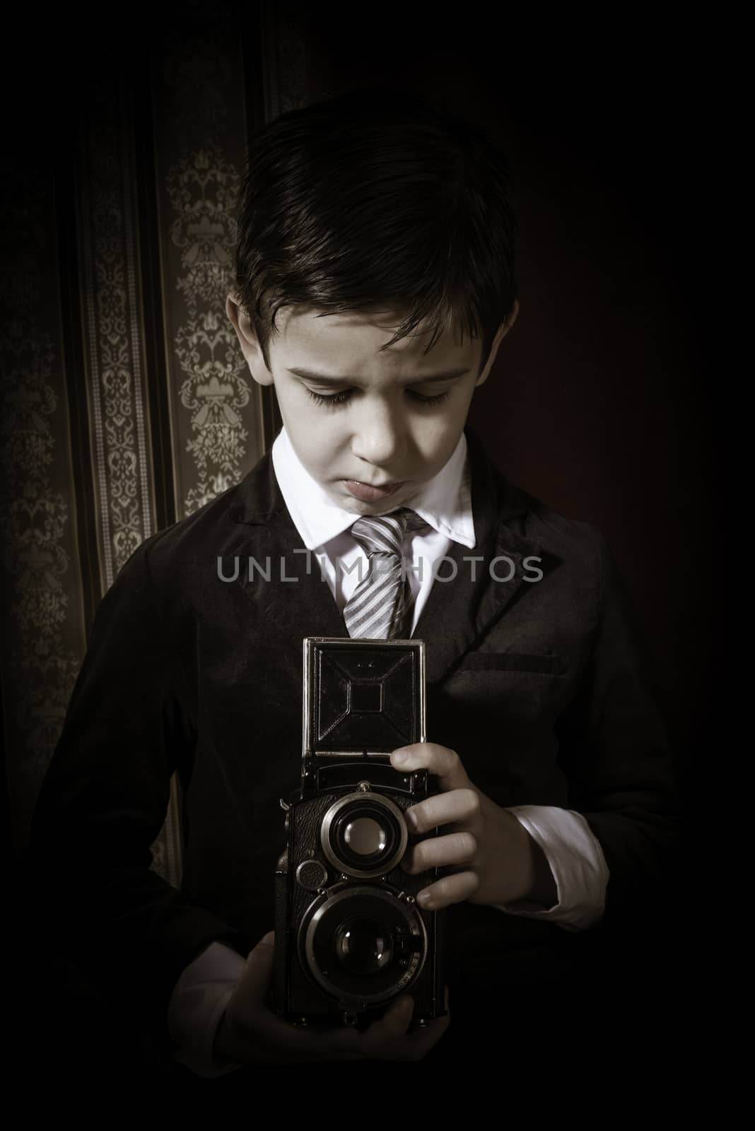 Boy with vintage camera. Vintage clothes