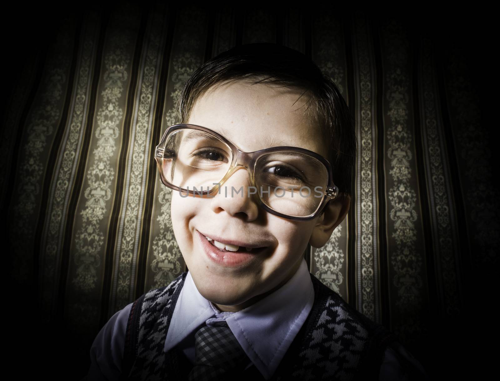 Smiling child with glasses in vintage clothes by deyan_georgiev
