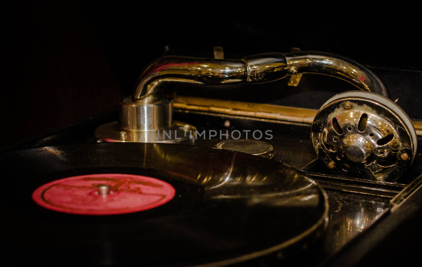 fragment of an old gramophone with a vinyl record