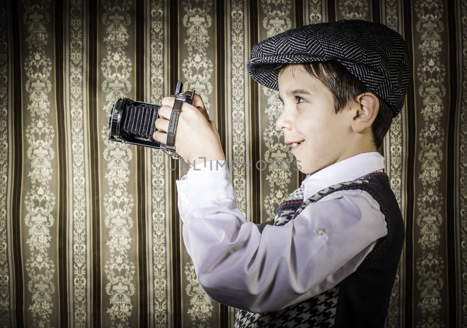 Child taking pictures with vintage camera by deyan_georgiev