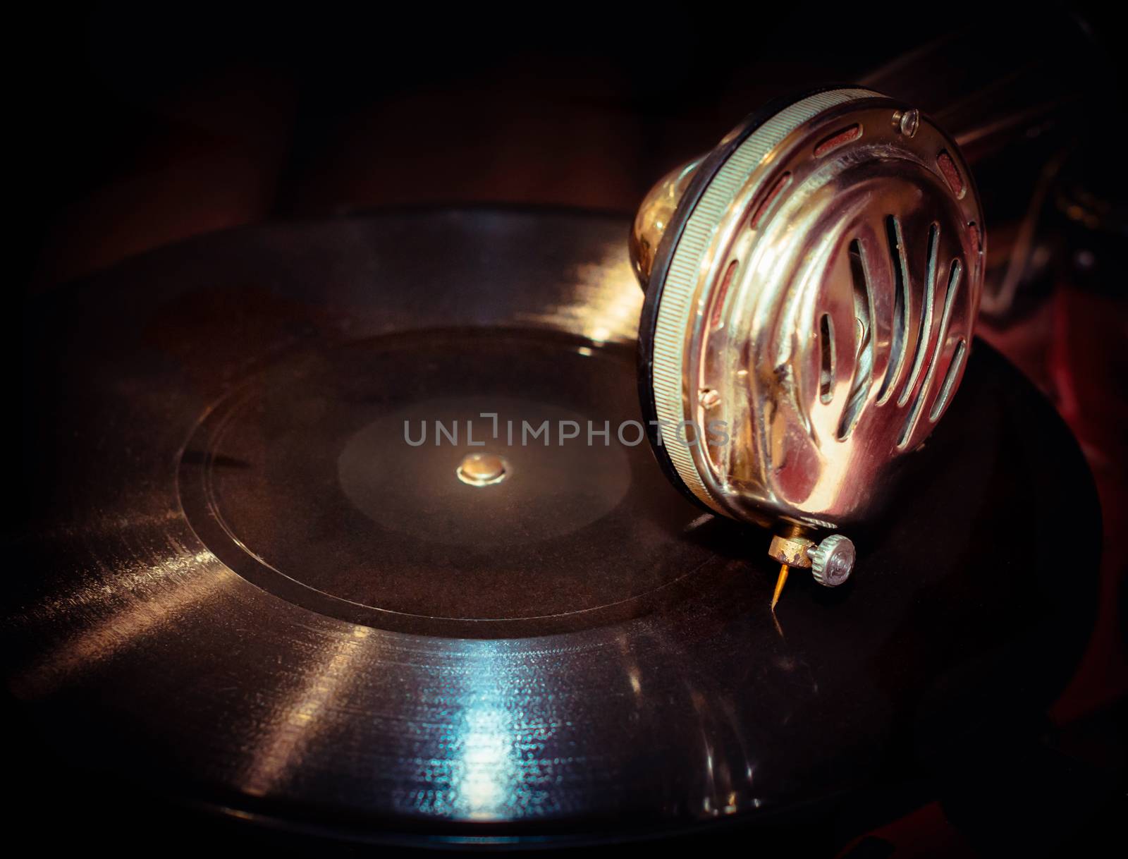 vinyl record and fragment of vintage gramophone closeup