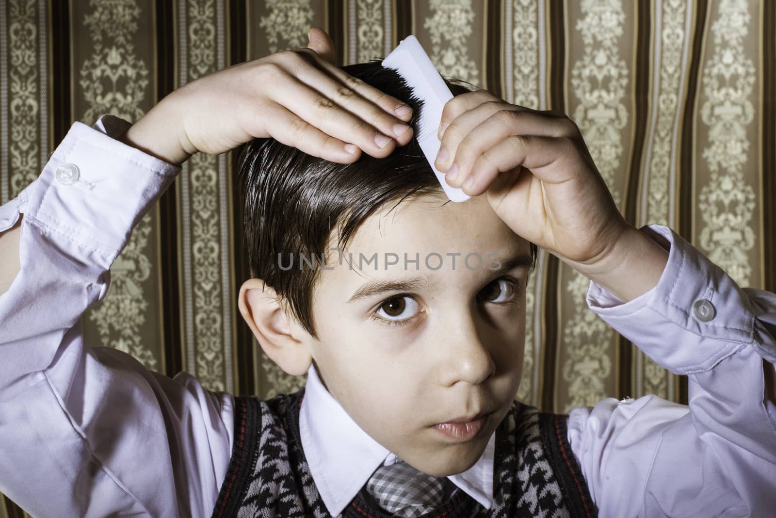 Child vintage clothes decided his hair. Close up shot