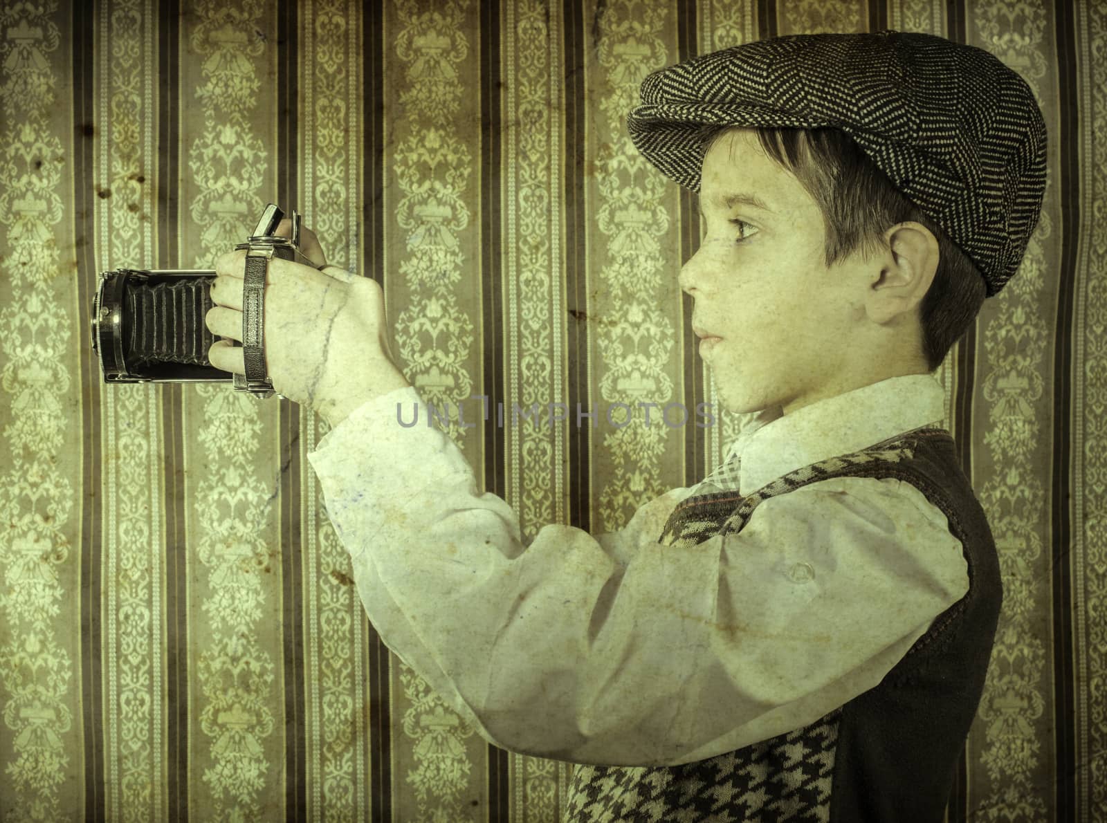 Boy with vintage camera. Vintage clothes