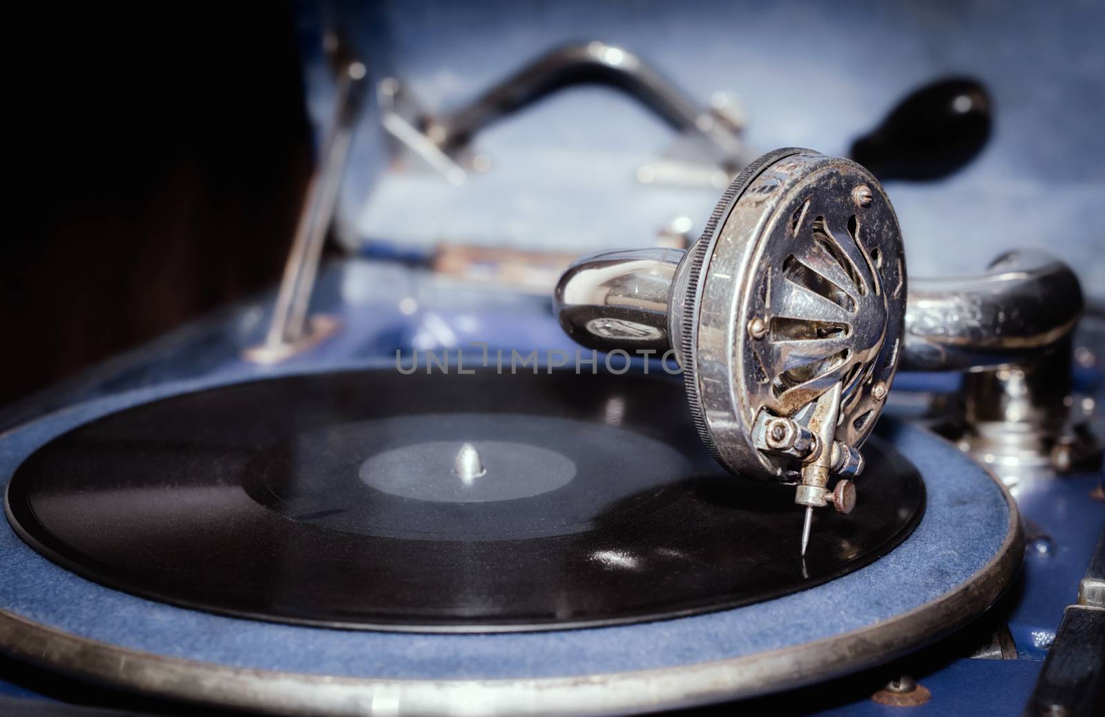 vinyl record and fragment of vintage gramophone closeup