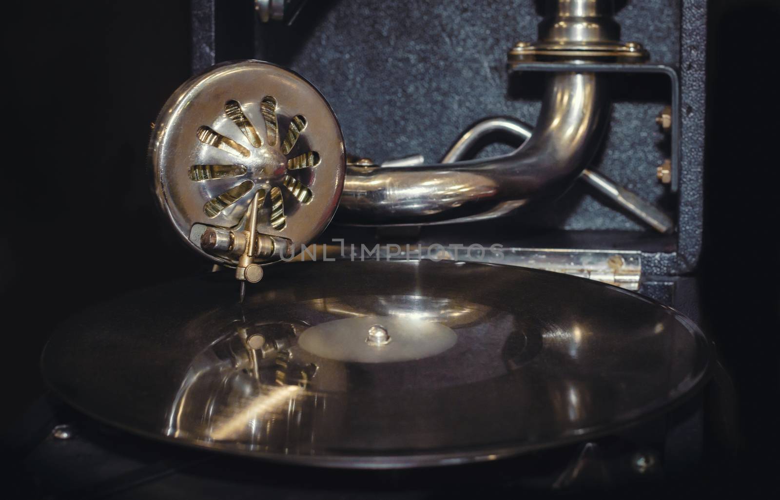 vinyl record and fragment of vintage gramophone closeup