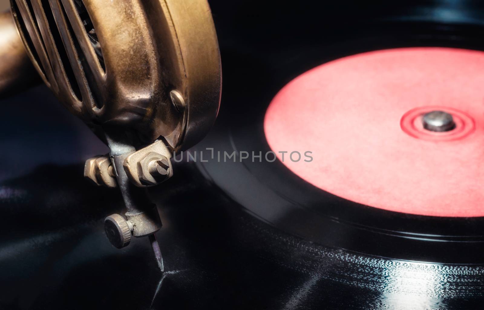 vinyl record and fragment of vintage gramophone closeup