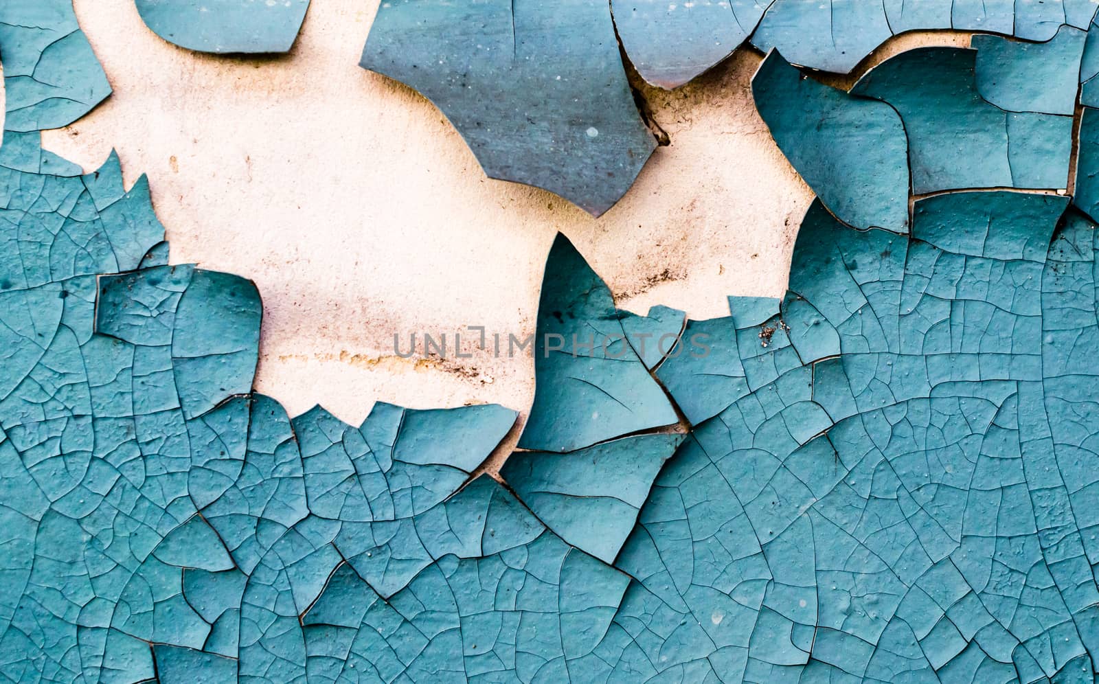 wall texture with cracked peeling blue paint