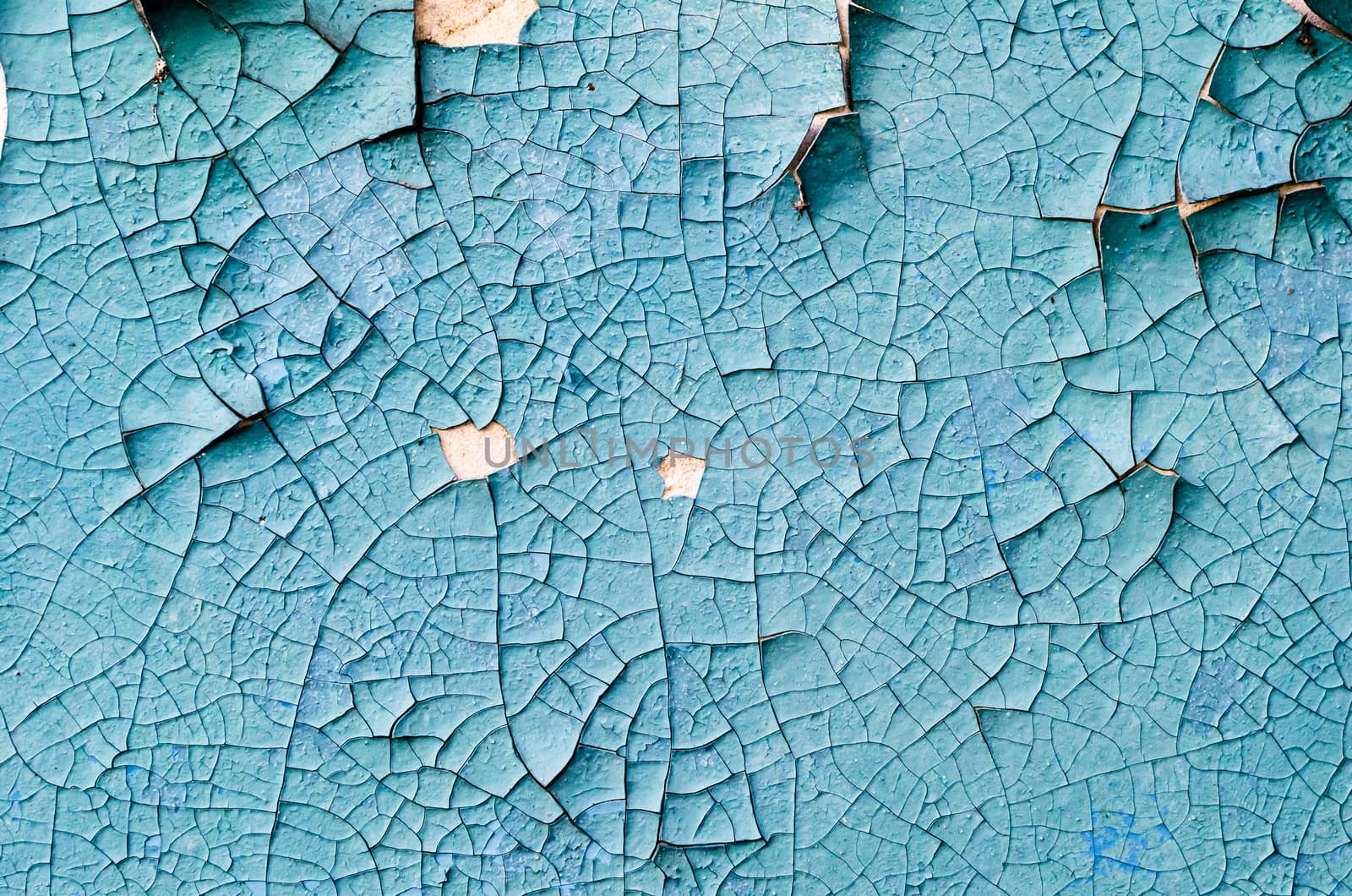 wall texture with cracked peeling blue paint