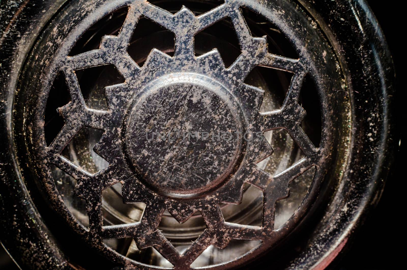 fragment of an old vinyl record player a metal pickup close-up macro