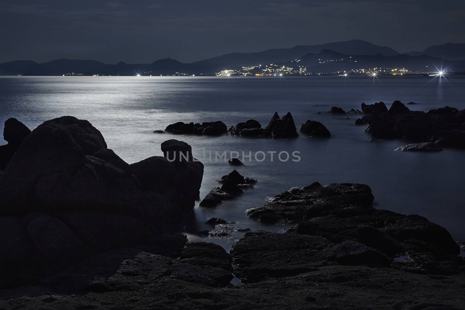 Rocks and sea illuminated by the moon by pippocarlot