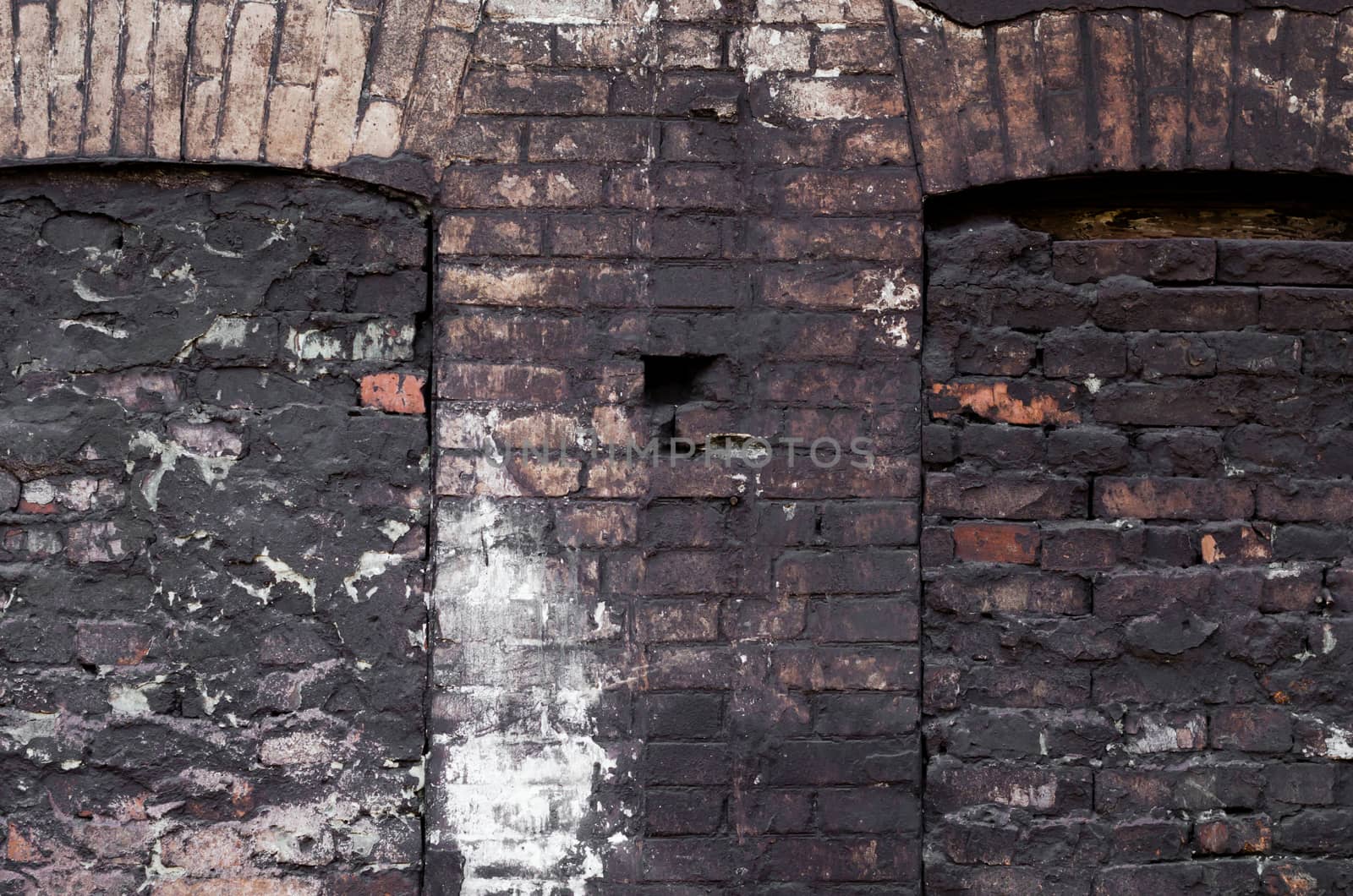 dirty shabby brick wall of an old house