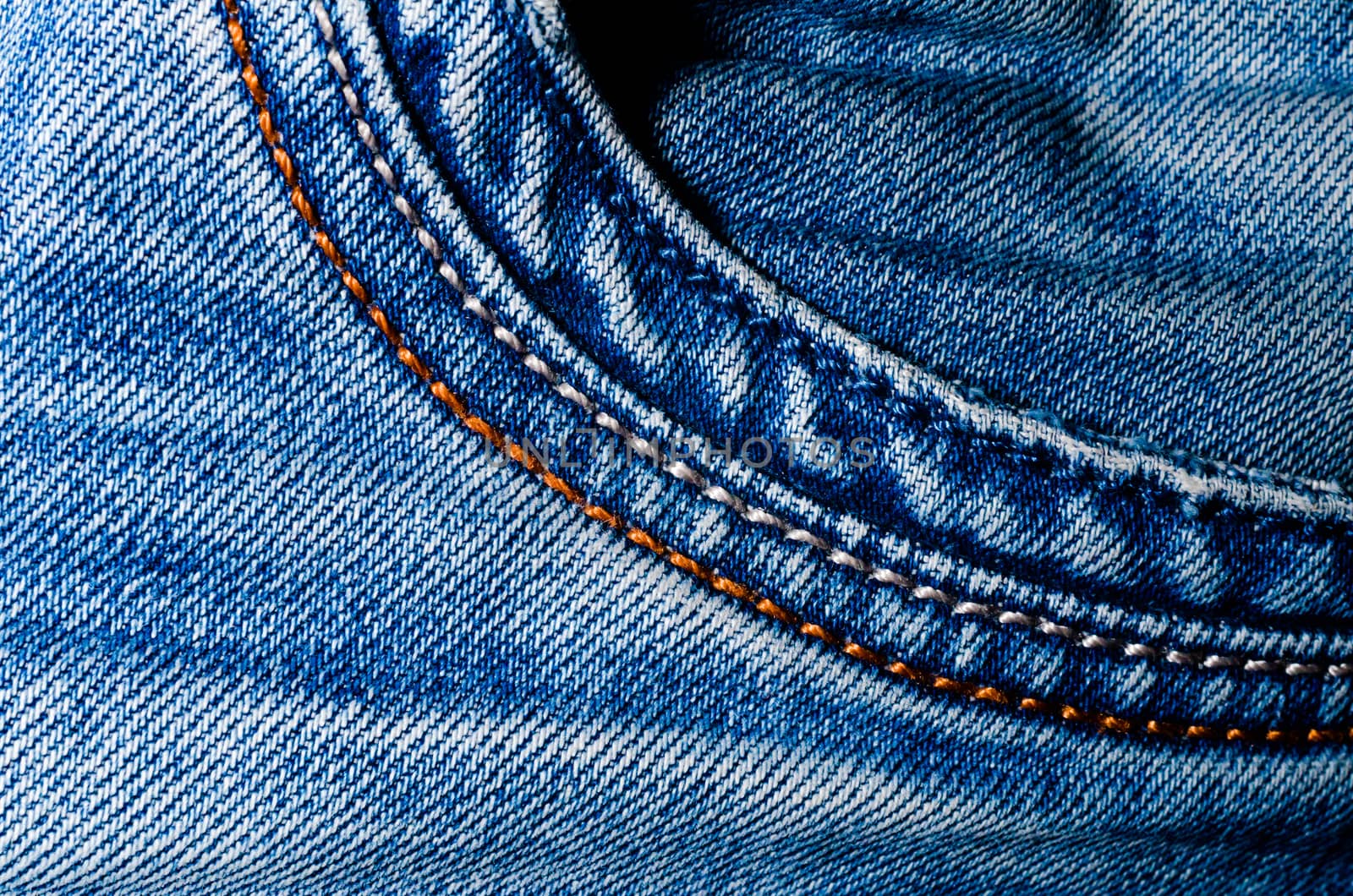 texture pocket of blue crumpled jeans macro closeup