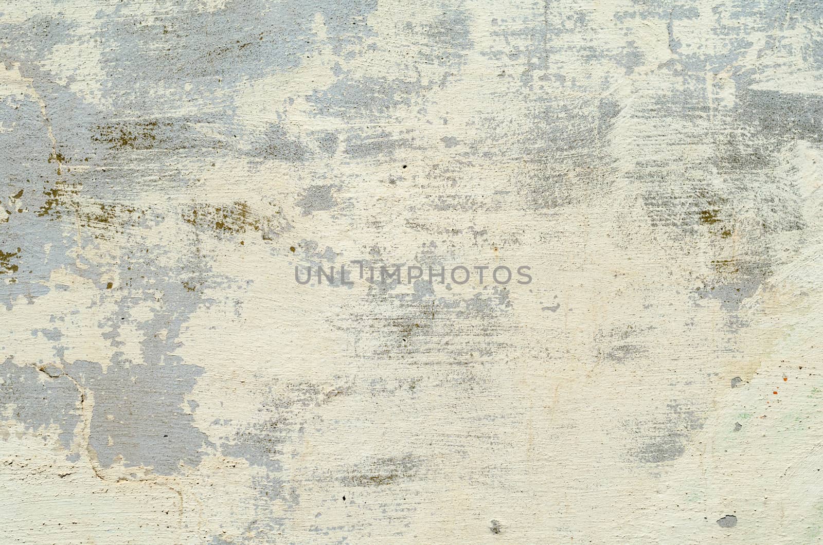 beige texture of the old concrete wall with the remains of paint
