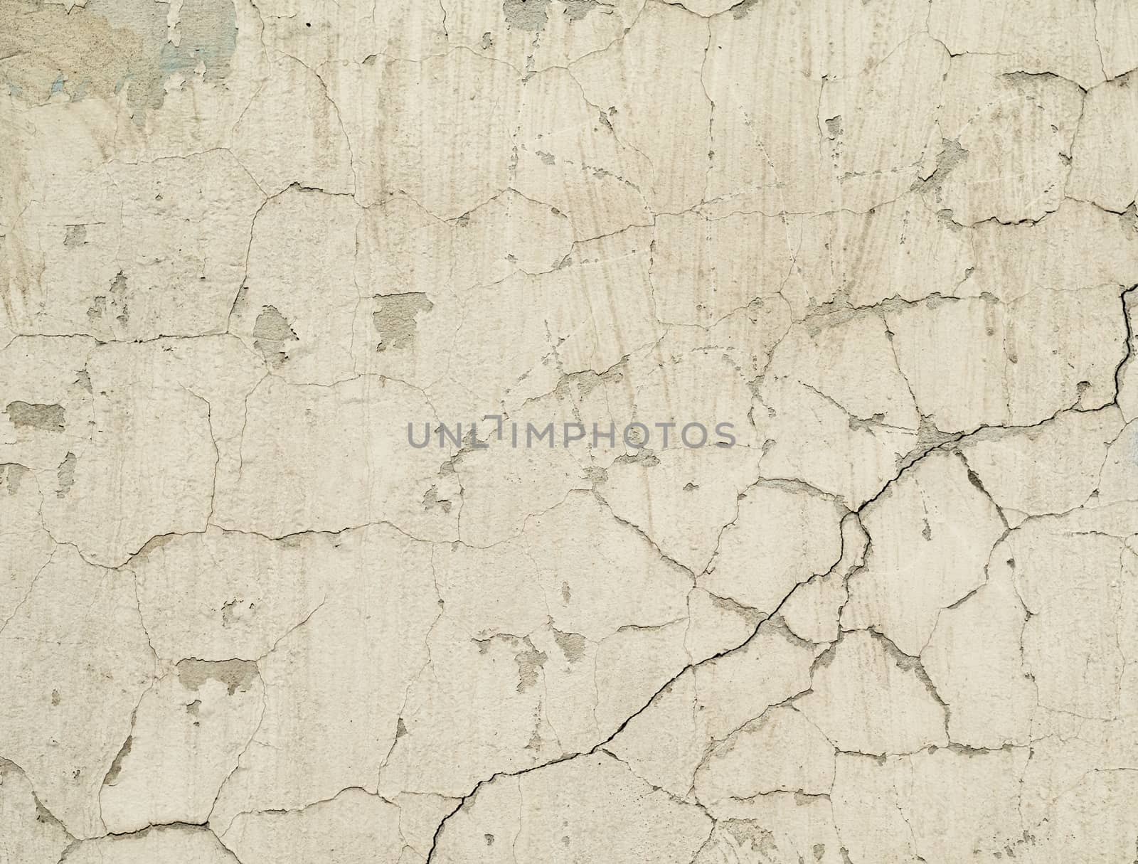 white texture old concrete wall with remains of plaster with cracks