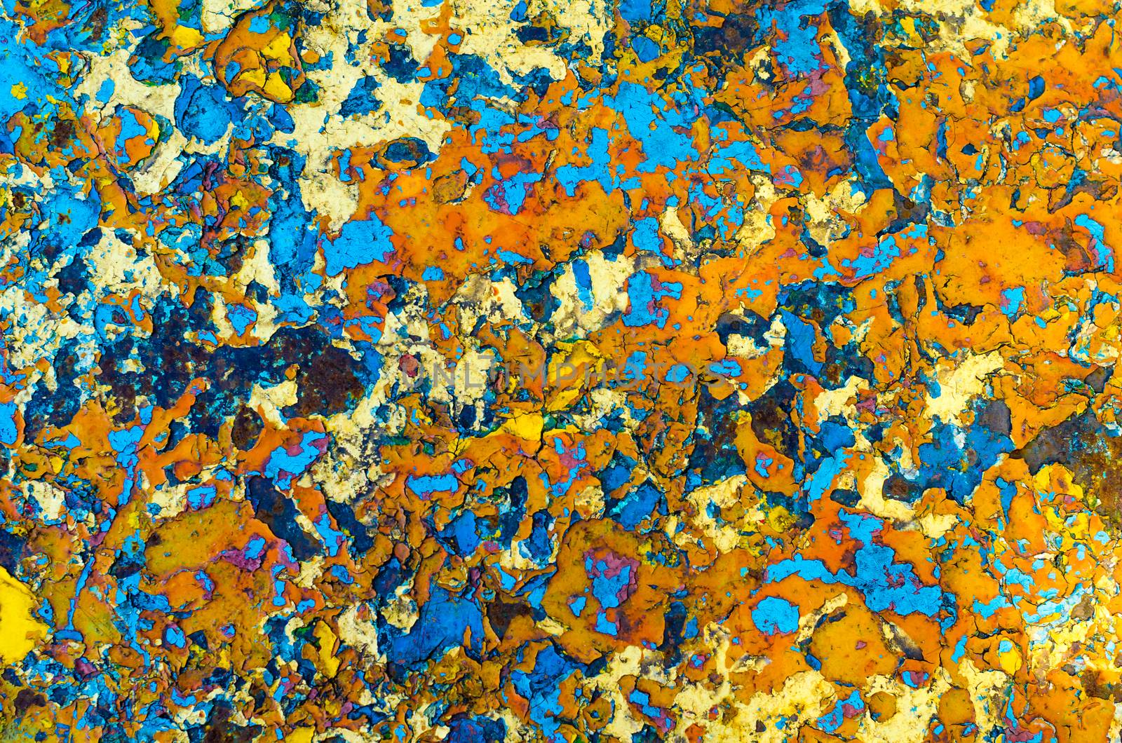 motley abstraction texture layers multicolored oil paint on rusty metal surface blue orange yellow