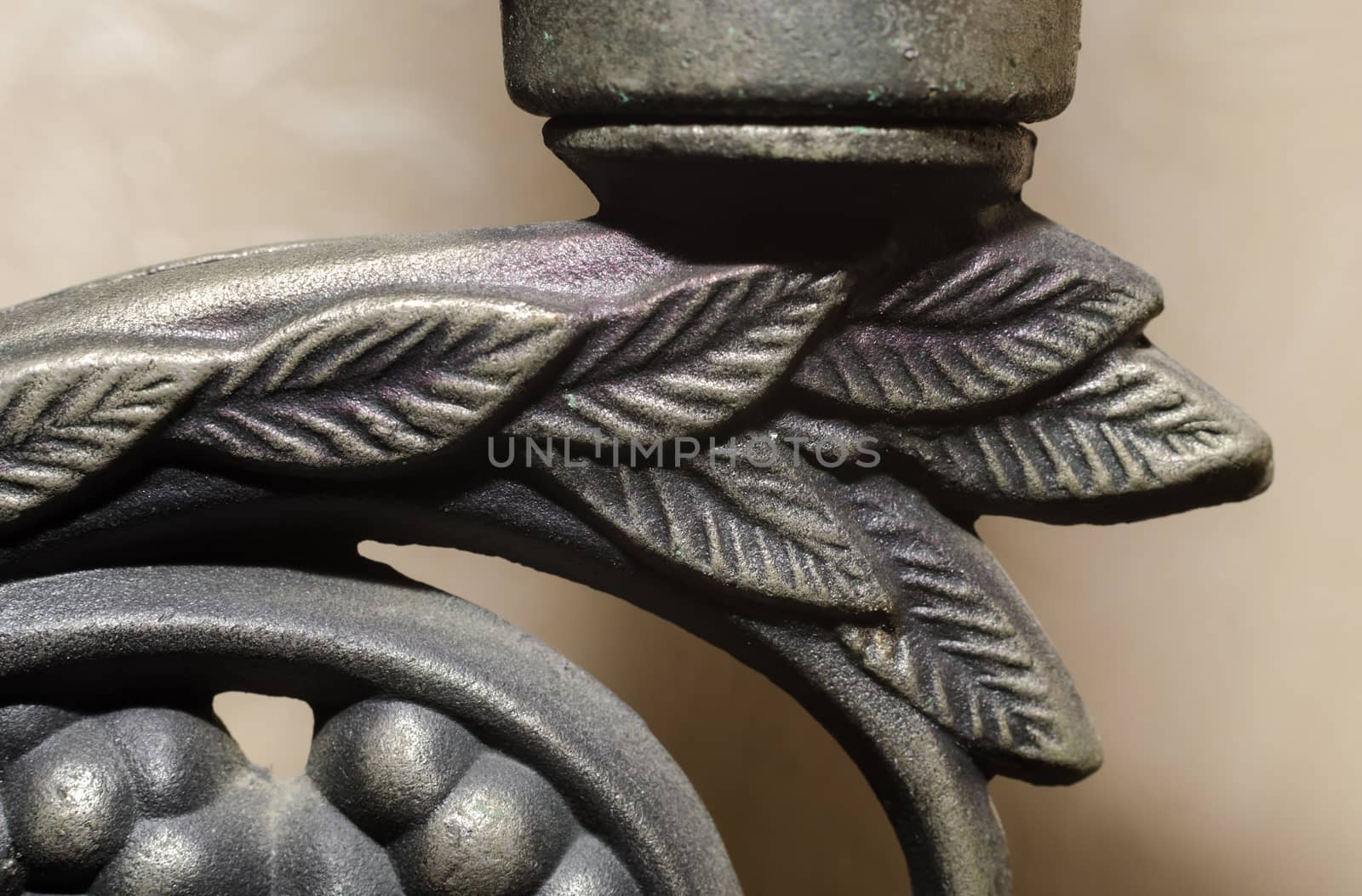 fragment of old metal candlestick macro closeup