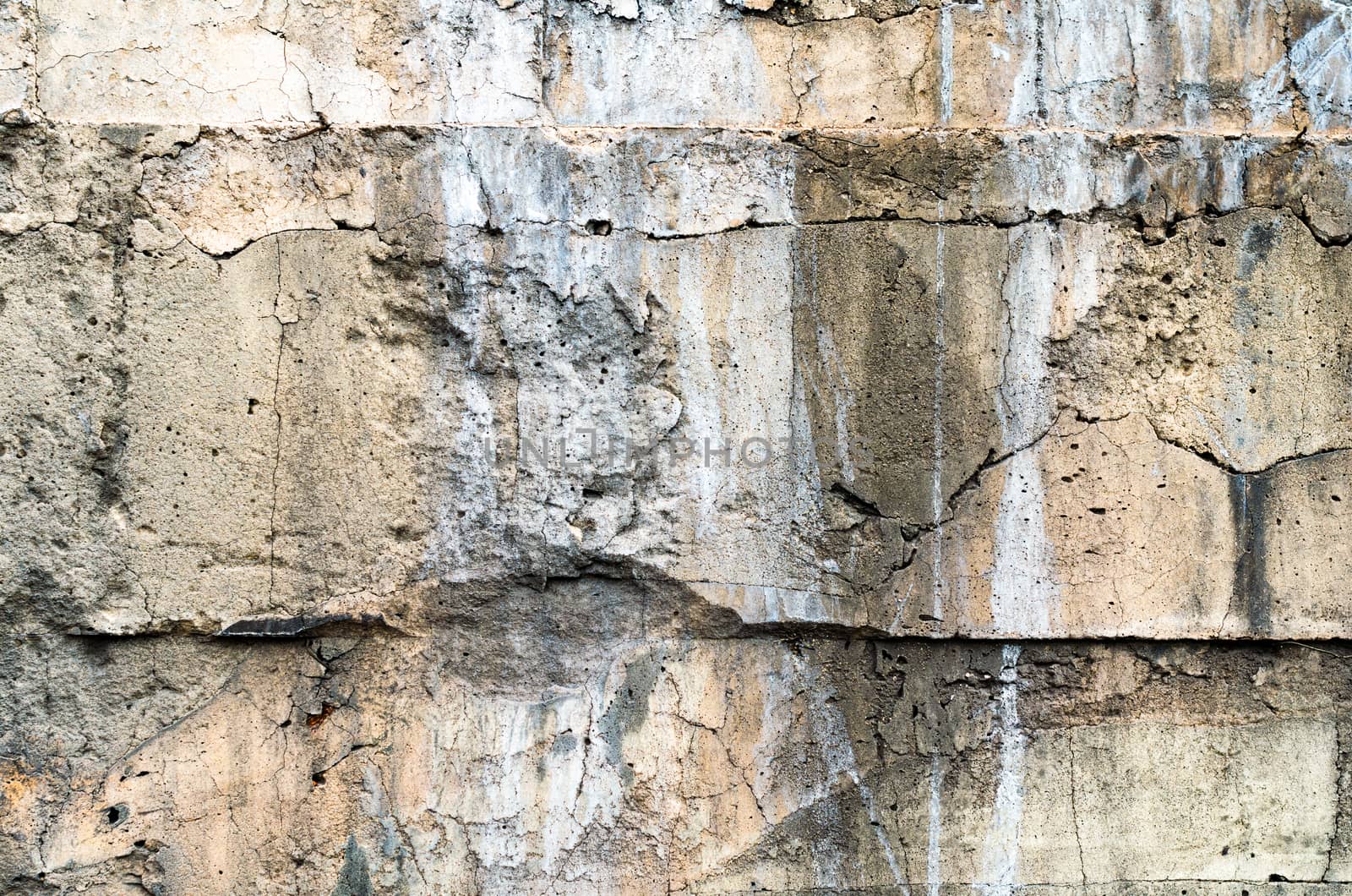 texture old concrete wall with traces of white paint
