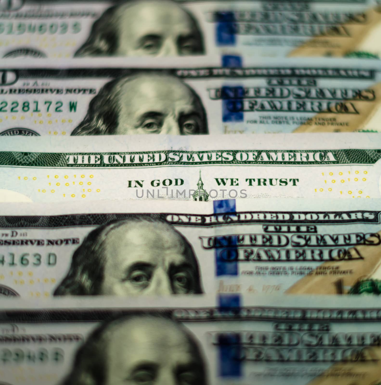 bill hundred US dollars closeup phrase in god we trust